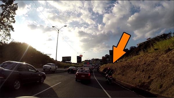 Motorcycle trying to pass using the shoulder